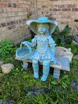 Vintage little girl on bench garden sculpture