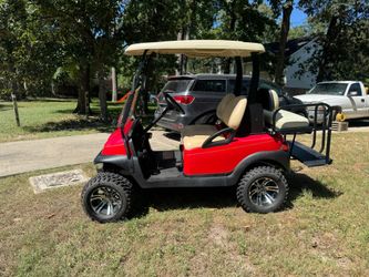 Red 4-Seat Golf Cart with Lifted Suspension