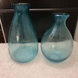 Two handblown crackle glass vases with a turquoise blue ombré color 9" and 8"