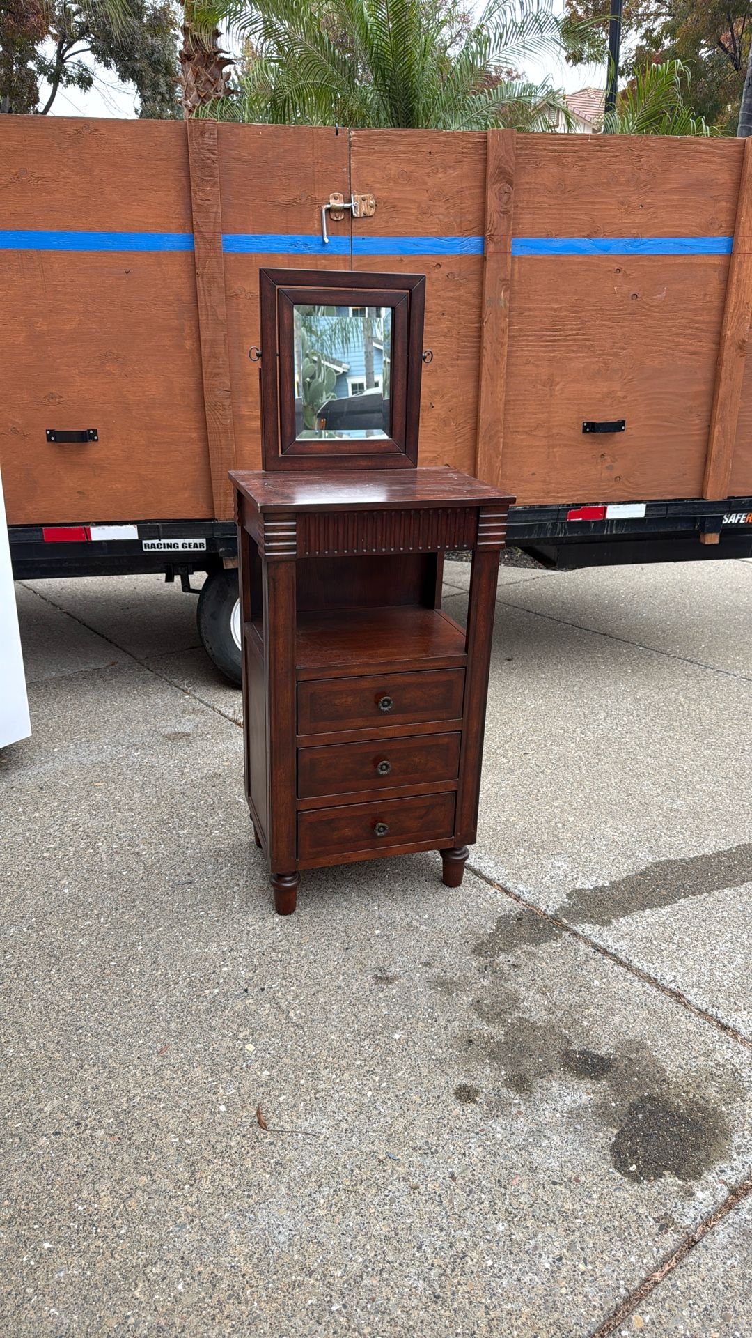 Antique furniture piece with drawers and swivel mirror