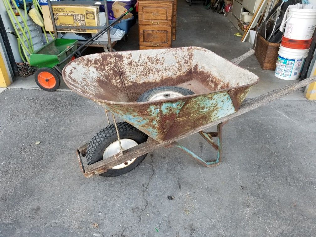 Vintage antique Jackson wheelbarrow with extra Wheel and Tire made in the USA very heavy duty