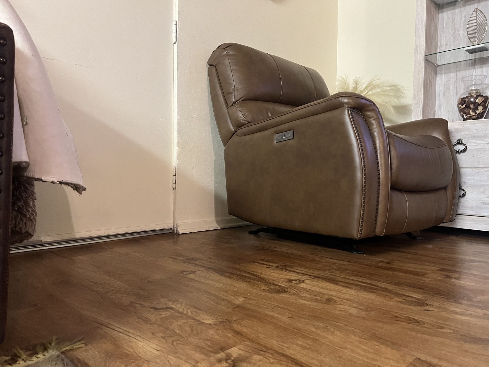 brown single reclining and rocking chair