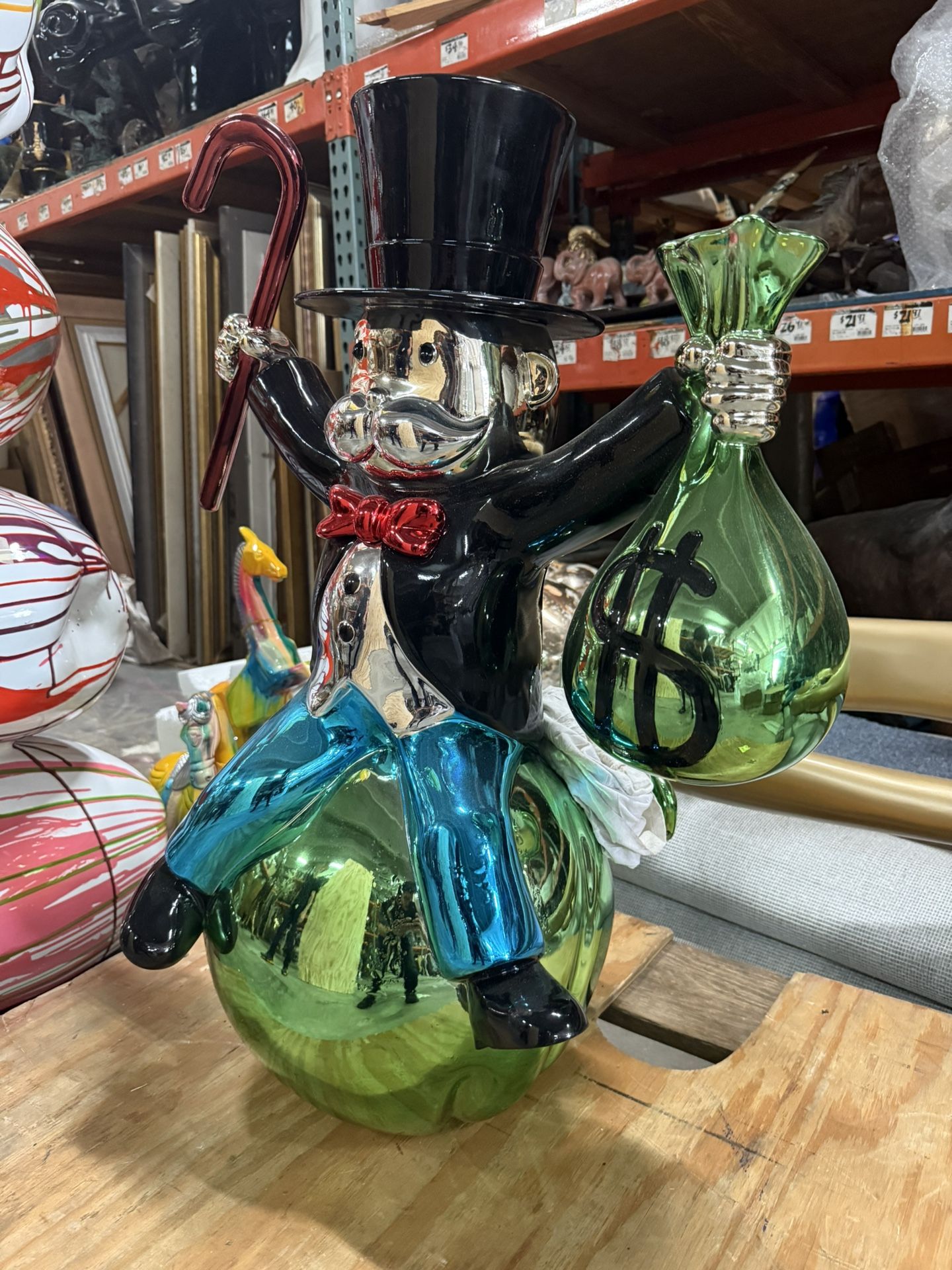 Monopoly Man Sitting On Bag Of Money Art Piece