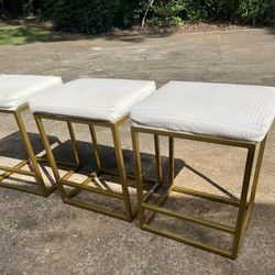 (3)THREE GOLD METAL COUNTER HEIGHT STOOLS