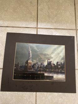 A beautiful picture of New York with the Statue of Liberty on it