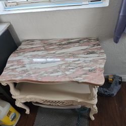 Side Marble Top Table Has Hints Of Pink White And Slightly Green Gray.