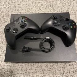 Xbox One X w/ 2 Controllers And Charging Station