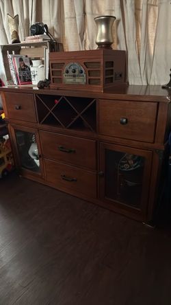 Solid Wood. Dining room buffet or can be used as a TV stand.