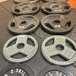 BRAND NEW Full Olympic  Weights Set of Plates: 45s, 35s, 25s, 10s, 5s and 2.5 pounders . Brute: 245 #