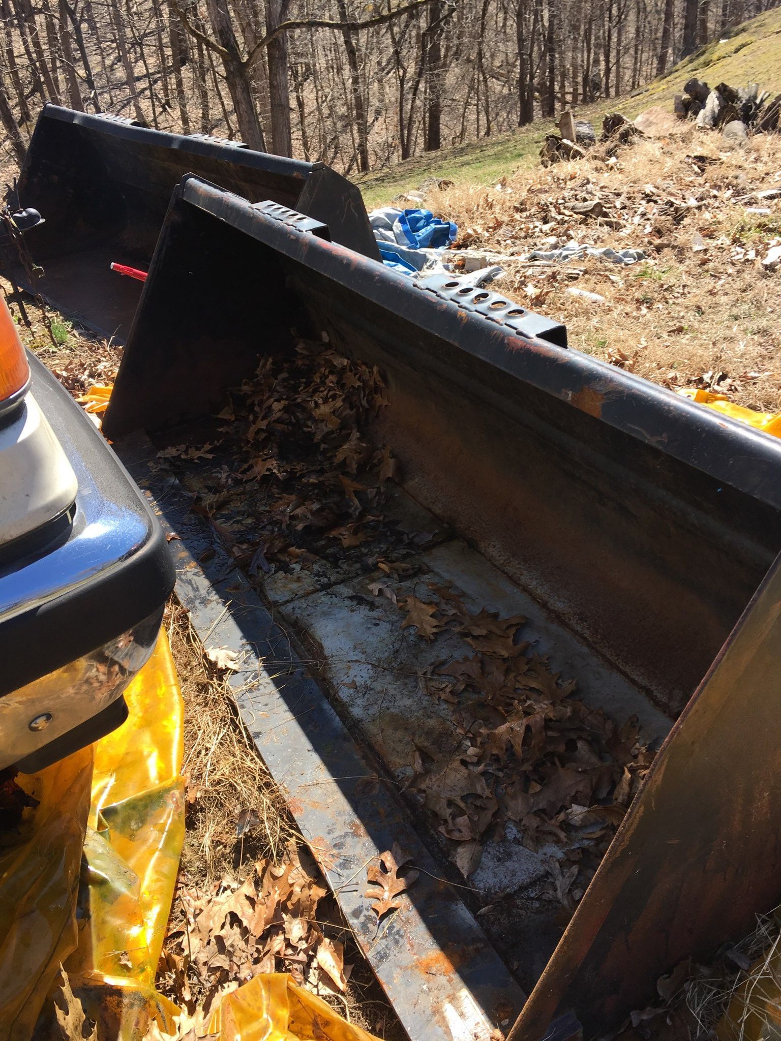 2 skid loader buckets