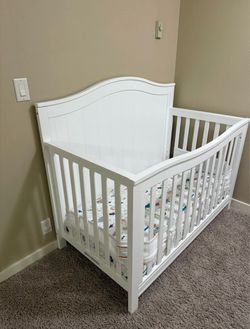 Convertible crib set + toys