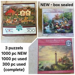 3 scenery puzzels: 1000 pc New + 1000 pc used complete as seen in pic + 300 pc used complete