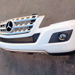 2006-2009 Mercedes ML350/500 Front Bumper With Grill And Emblem And Inner Accessories OEM.