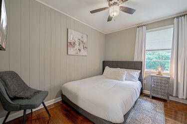 Mattress and upholstered grey bed frame