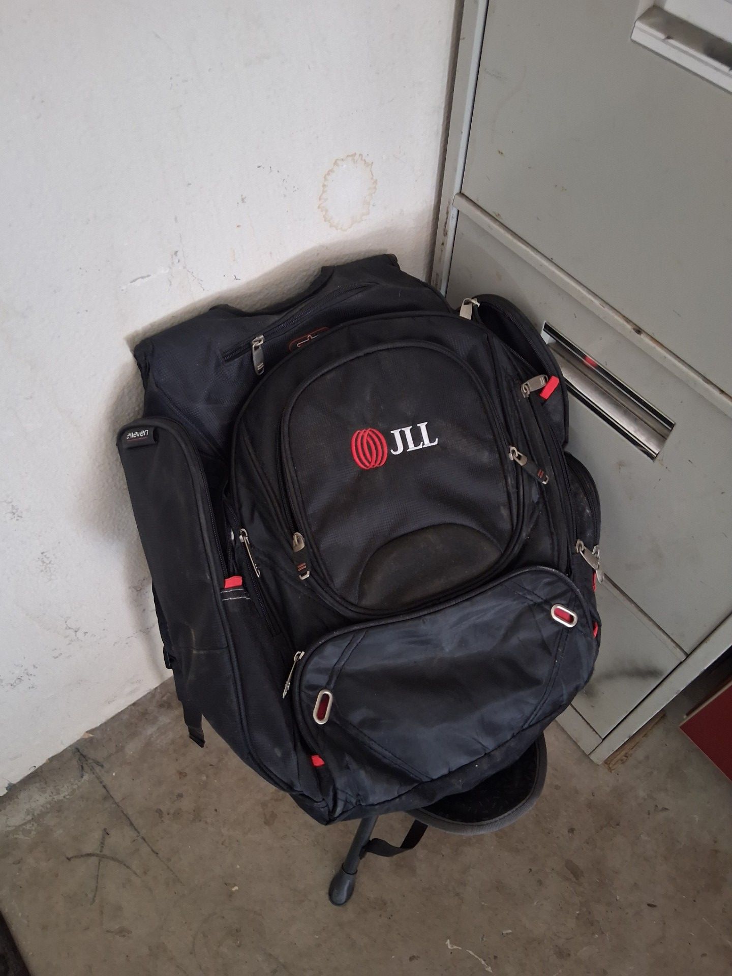 Elleven checkpoint-friendly laptop backpack featuring a JLL company logo.