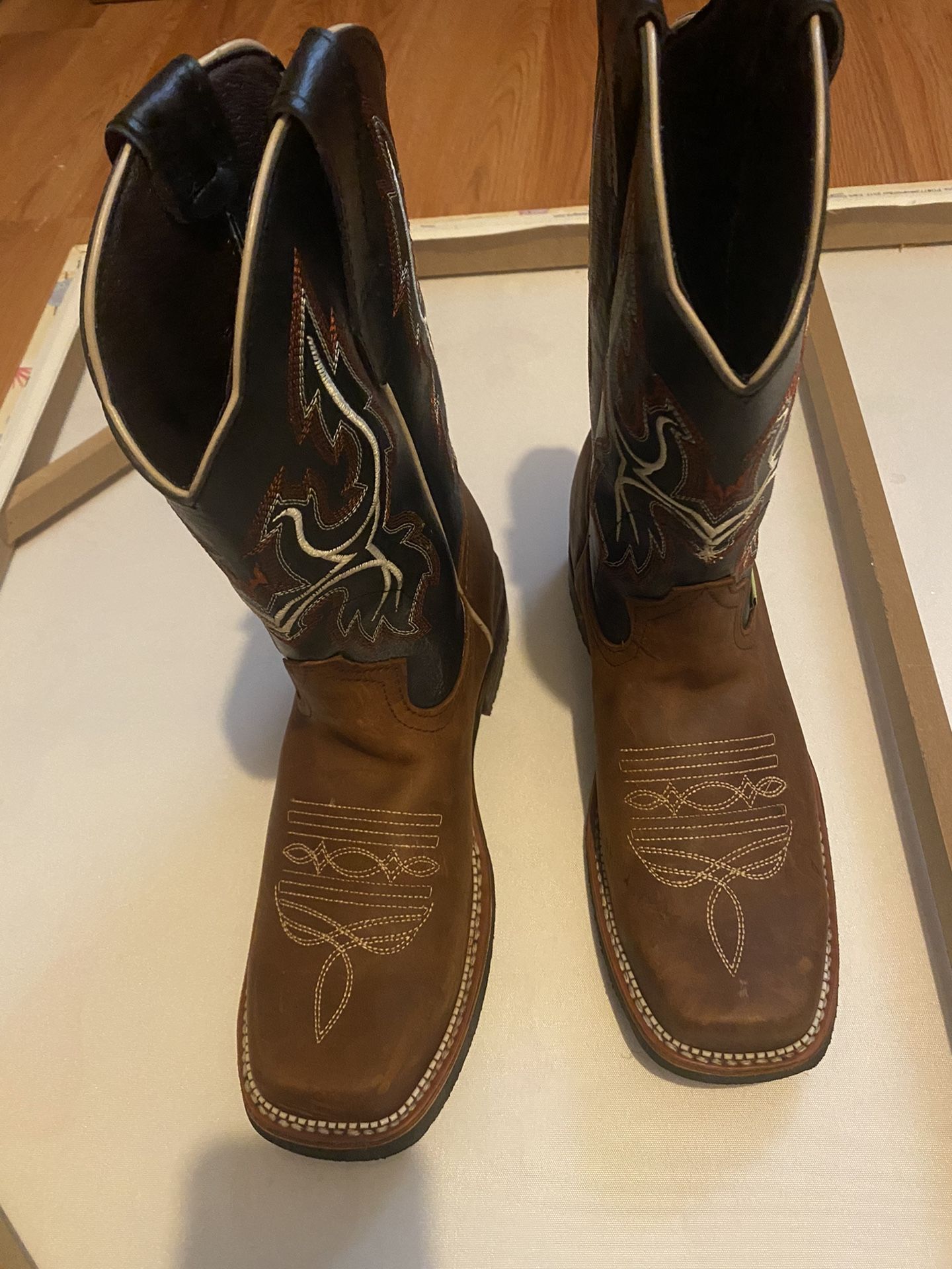 I am selling these new leather cowboy boots my wife bought them for me but when I tried them they were too big for me, located in Ewin Nj