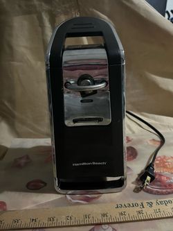Can opener, electric, it opens cans along the sides, no pushing in lids and trying to remove them! Works great, clean and no rust