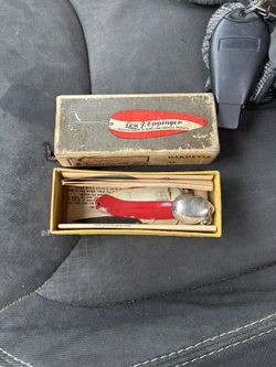 vintage Lou J. Eppinger Dardevle No. 9 fishing lure in the classic red and white color with its original box. 
