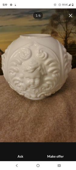 White Ceramic Vase with Embossed Face Design