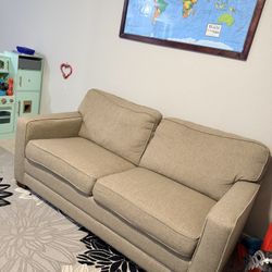Beige color fabric couch which can convert to full size bed