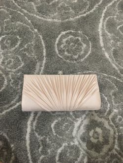 Formal wristlet used and shows signs of wear