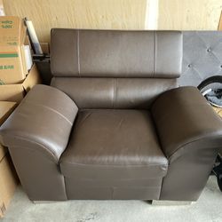 brown leather one seat couch (adjustable headrest)