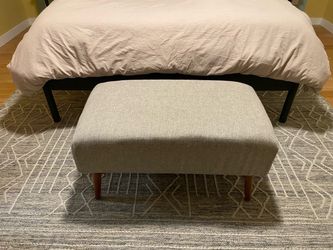 Light Gray Upholstered Ottoman with Wood Legs