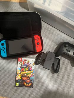 Nintendo switch with case, Mario 3D world and controllers