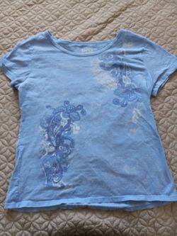 Blue shirt with white accents