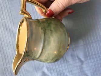 Small green and gold pitcher