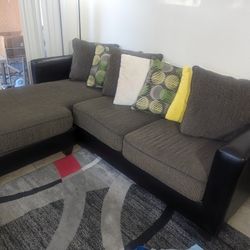 Left Facing Sectional. Gray With Pillows