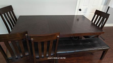 Wooden dining table for (4-8) people with 4 chairs and  bench for 3 people in good condition, it has extension peace, driveway pickup.
Table L60"*W42"