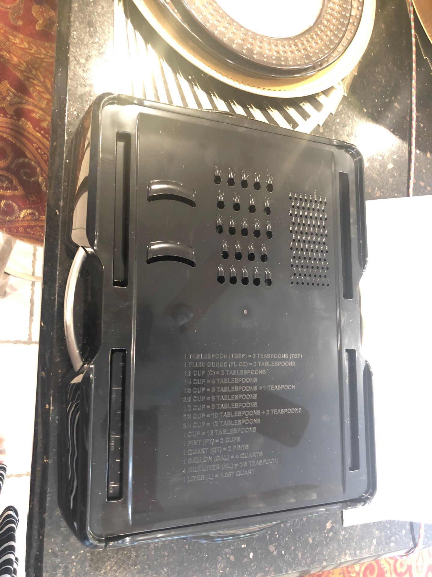 Muti uses cutting board cheese grater etc with measurement and compartments