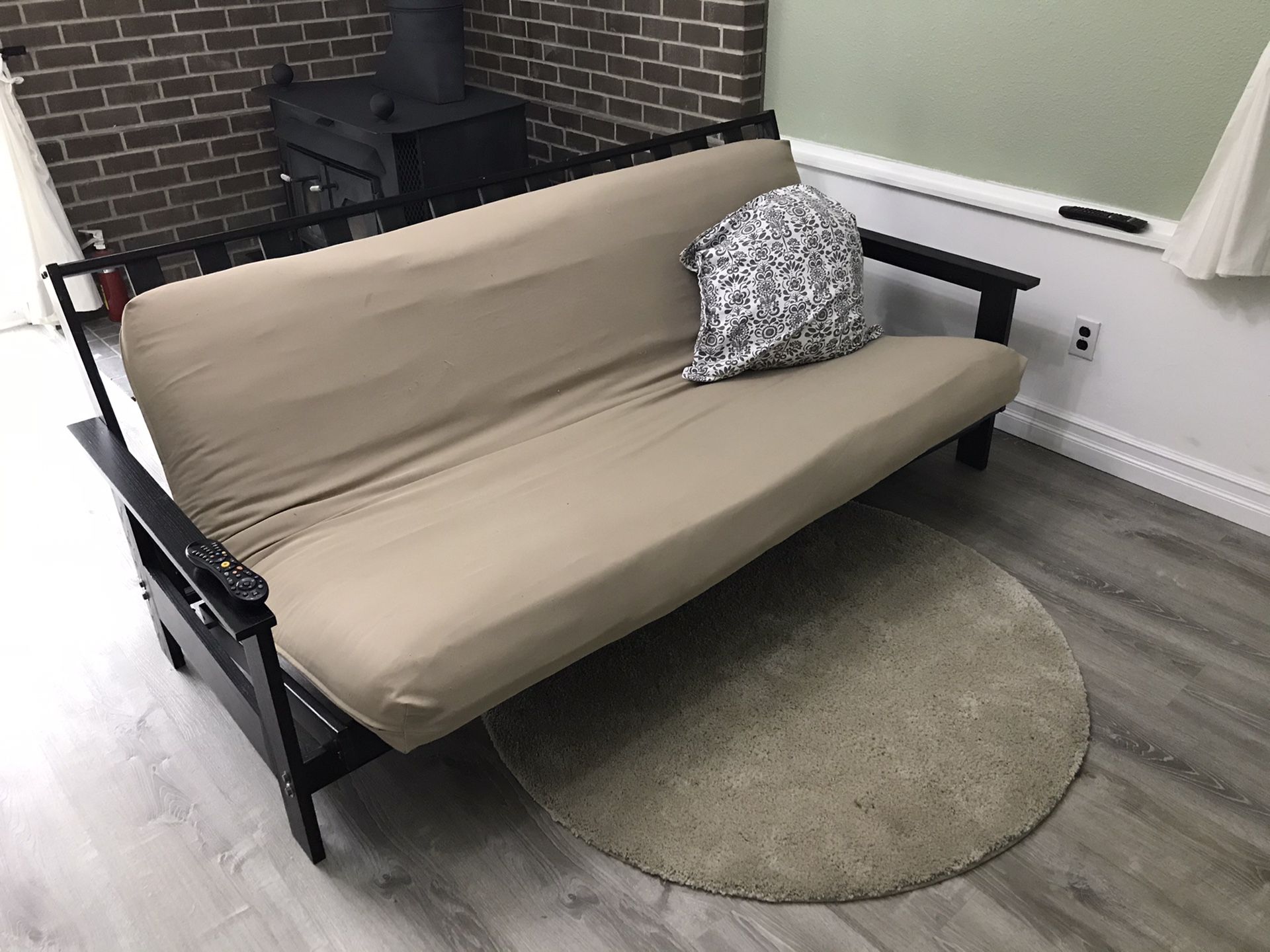 Futon bed sofa with area rug