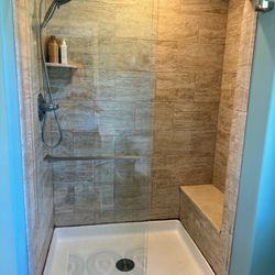 Frameless Glass Sliding Shower Door With Towel Bar. Available Late May 2024