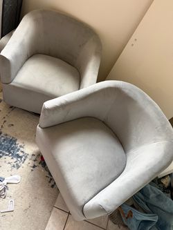 Two swivel accent chairs