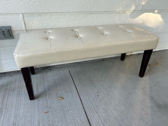 Cream tufted bench