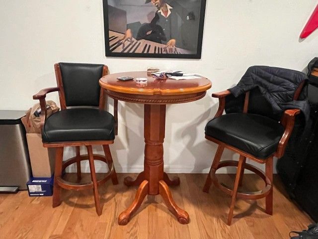 Pub Table and 2 Leather Swivel Chairs (Solid, No Rips Or Tears)