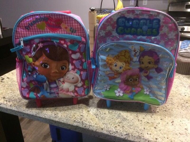 2 rolling backpacks (Bubble Guppies & Doc McStuffins)
