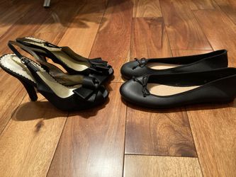 Two pairs of like new size 7 women’s shoes- black heels and black flats