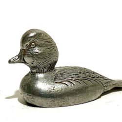 miniature pewter duck figurine. These small collectibles were popular, particularly in the 1970s and 1980s, and were often made by various artists and