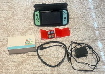 Nintendo switch animal crossing good condition and 4 games
