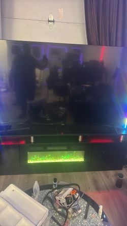Hisense  75” tv with 3D fire place tv table