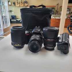Nikon D5500 camera with two senses vertical battery grip and charger