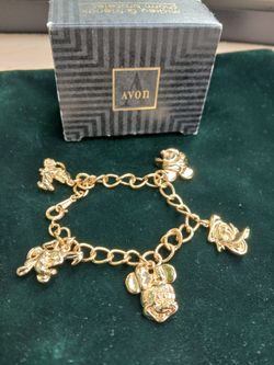 Vintage Avon hickey and friends charm bracelet