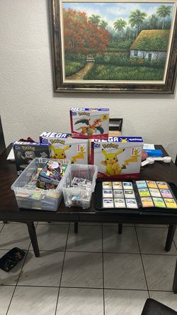 Entire Card Collection (Mostly Pokemon & sports) also throwing in 3 Pokemon Collectible in the box