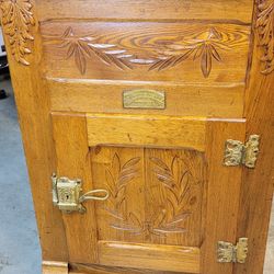 Antique icebox cabinet, manufactured by The Northern Light Company.