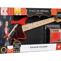 F.A.O SCHWARZ  Kid Sized Real Guitar With Powerful Mini Amp And 11 Stickers (Price Negotiable)