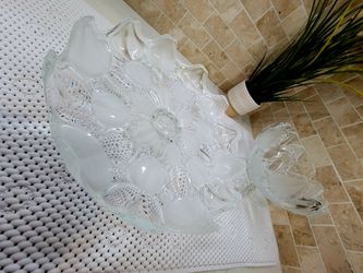 Vintage glass set featuring a heavy, pressed circular design. Includes a large cake stand and a fruit bowl, both with pedestal bases. They showcase fr