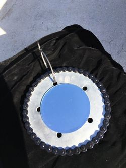 A mirror in a motorcycle chain and sprocket